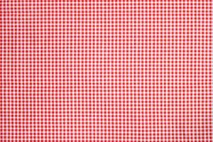 röd vit pläd bordsduk bakgrund foto