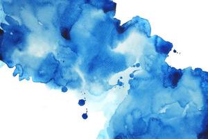 indigo blå vattenfärg hand målning och stänk abstrakt textur på vit papper bakgrund. foto