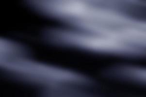 suddig och svart slät lutning bakgrund, abstrakt. foto