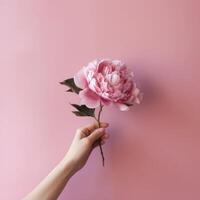 hand med rosa pion blomma. illustration ai generativ foto