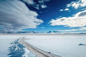 ai genererad omfattande vidd av frysta tundra med snötäckt bergen i de distans och en klar blå himmel över huvudet. foto