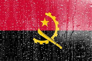 3d flagga av angola på en glas foto