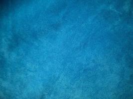 blå sammet tyg textur används som bakgrund. tom blå tygbakgrund av mjukt och smidigt textilmaterial. det finns plats för text. foto
