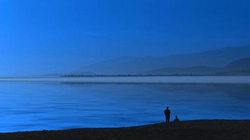 marinmålning blå kväll och silhuetter av människor. foto