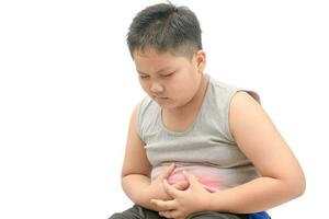 asiatisk fett barn lidande från magont foto