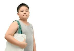 fett pojke innehav duk toto väska isolerat foto