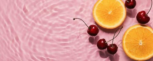 apelsiner och körsbär i rosa vatten baner med koncentrisk cirklar och krusningar. uppfriskande sommar begrepp, kopia Plats foto