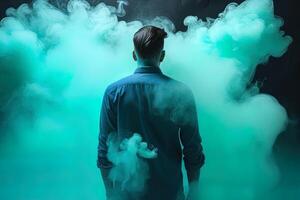 en man stående i främre av en moln av rök med de cyan tema. ai genererad foto