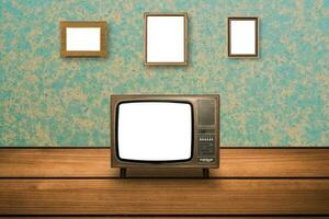 gammal tv på trä- golv och Foto ramar på vägg
