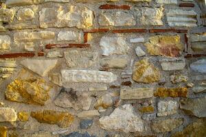 gammal medeltida sten vägg textur bakgrund. foto