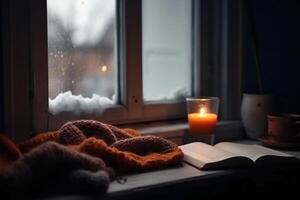 jul bakgrund. en kopp av te, böcker, en ljus och en stickat scarf på de fönster bakgrund. ai generativ foto