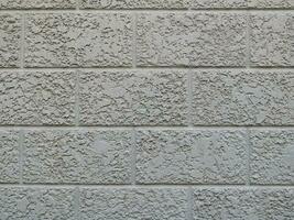 rektangel form cement vägg, grov yta ljus grå betong. foto