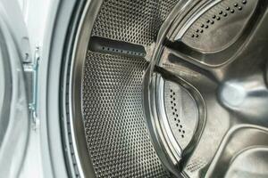rena rostfri stål tvätt maskin trumma foto