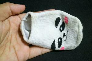 söt bebis strumpor med panda ansikten foto