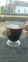 en kopp svart kaffe foto