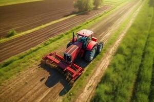ai genererad. antenn topp se av röd traktor klippning grön fält. verklig Foto fångande vibrerande lantbruk i handling.