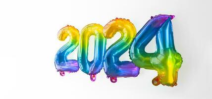 2024 ny år begrepp förbi regnbåge folie ballonger tal. foto