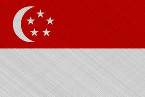 flagga av singapore på en texturerad bakgrund. begrepp collage. foto