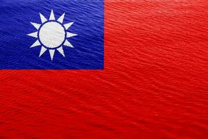 flagga av republik av Kina taiwan på en texturerad bakgrund. begrepp collage. foto
