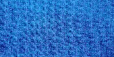ljus blå Färg abstrakt denim jacka, årgång denim jeans trasa och tyg stänga upp makro Foto för bakgrund
