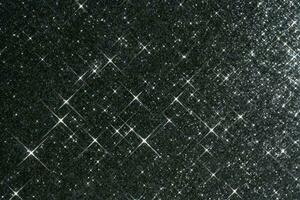 abstrakt svart bakgrund med pärlar i de form av stjärnor. foto