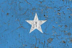 3d flagga av somalia på ett gammal sten vägg bakgrund. foto