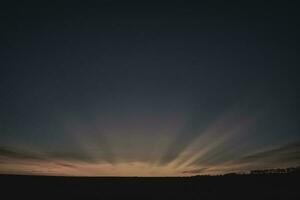 solstrålar på solnedgång, patagonien , argentina foto