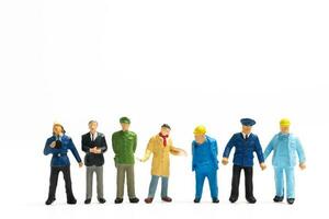 miniatyr- människor annorlunda yrken stående på vit bakgrund , arbetskraft dag begrepp foto