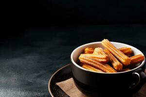 utsökt churros mörk bakgrund med tömma Plats för text foto