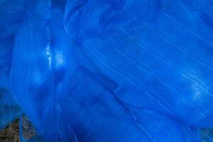 genomskinlig blå netto tyg kan vara Begagnade som en bakgrund tapet foto