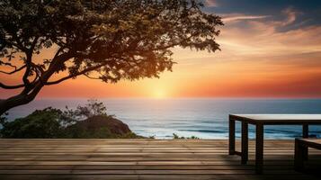 trä- tabell på de strand med hav se under solnedgång eller soluppgång silhuett av tropisk träd på terrass idyllisk havsstrand foto