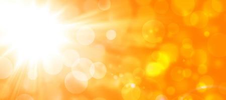 orange höstabstrakt bakgrund med sol och bokeh foto