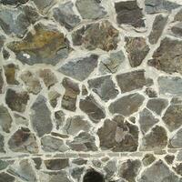 sten textur tillverkad av annorlunda stenar foto