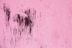 rostig rosa metall abstrakt bakgrund. textur av ett gammal tallrik med droppande färgade knäckt måla foto