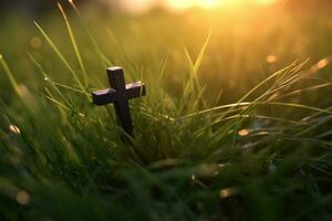 konceptuell svart korsa religion symbol silhuett i gräs över solnedgång eller soluppgång himmel genererad foto