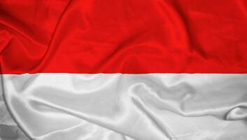 indonesiska nation flagga vågig satin topp ängel Foto