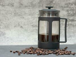 franska Tryck kaffe tillverkare pott och kaffe bönor foto