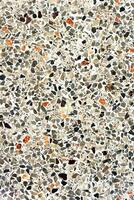 mönster sammansatt av bitar av granit, kvarts, glas och sten. marmor golv textur. vit klassisk stenläggning design. abstrakt vägg bakgrund. foto