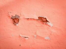 abstrakt bakgrund textur av ett orange skadad vägg foto