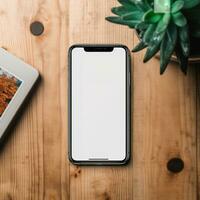 ai generativ en vit skärm cell telefon på en trä- tabell foto