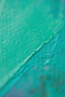 närbild av abstrakt grov konst målning textur, med olja penseldrag, lastpall kniv måla på duk foto