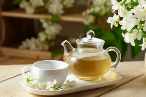 grön te med jasmin blomma och vit keramisk tekanna.generativ ai. foto