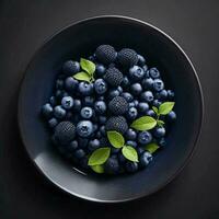 en tallrik av blåbär på svart bakgrund, topp se, ai generativ foto