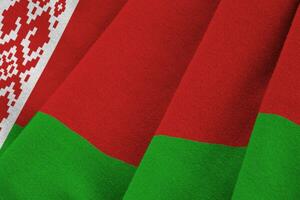 Vitryssland flagga med stor veck vinka stänga upp under de studio ljus inomhus. de officiell symboler och färger i baner foto
