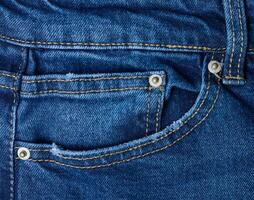 blå jeans främre ficka med knappar, stänga upp foto