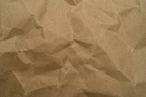 återvinna papper textur bakgrund. skrynkliga gammal kraft papper abstrakt form bakgrund med Plats papper för text hög upplösning foto