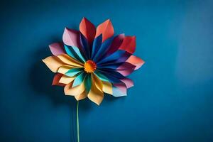 en färgrik blomma tillverkad ut av papper på en blå vägg. ai-genererad foto