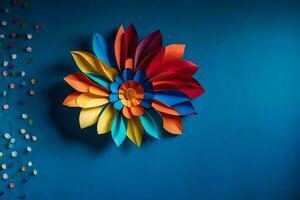 en färgrik papper blomma på en blå vägg. ai-genererad foto