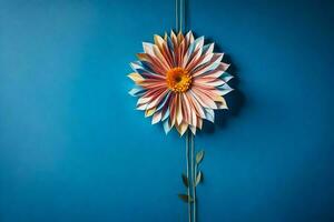 en blomma tillverkad ut av papper på en blå vägg. ai-genererad foto