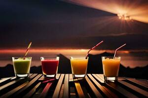 fyra glasögon av juice på en tabell med en solnedgång i de bakgrund. ai-genererad foto